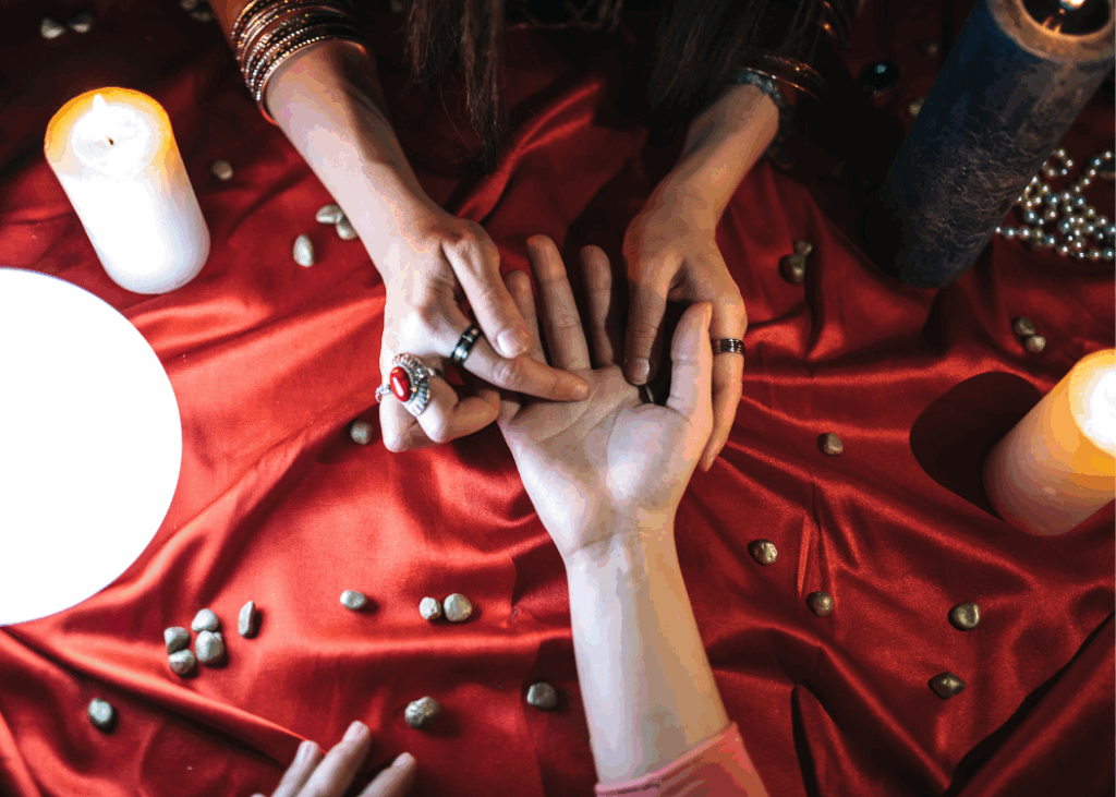 two hands with other hands performing palm readings